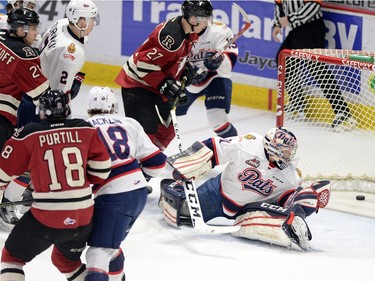 Regina Pats goalie Tyler Brown #31 looks behind him as the Red Deer Rebels get a first period goal in WHL playoff action at the Brandt Centre in Regina on Wednesday.