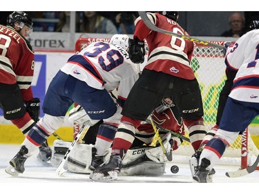 Regina Pats Lane Zablocki #39 puts the loose puck past  Red Deer Rebels goalie Trevor Martin #35 in second period WHL playoff action at the Brandt Centre in Regina on Wednesday.