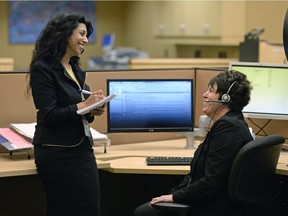 HealthLine manager Sangeeta Gupta, left, and Michelle Fisher, clinical manager of HealthLine, urge more refugees to call 8-1-1 with their health-care concerns.