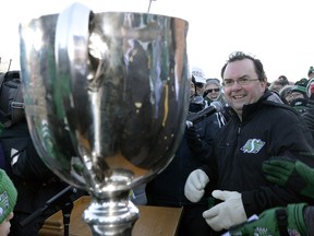 Then-Saskatchewan Roughriders general manager Brendan Taman celebrates a Grey Cup title during the team's championship parade in 2013. Taman has since been criticized for excessive spending when, in reality, he got value for the money in the appraisal of columnist Rob Vanstone.