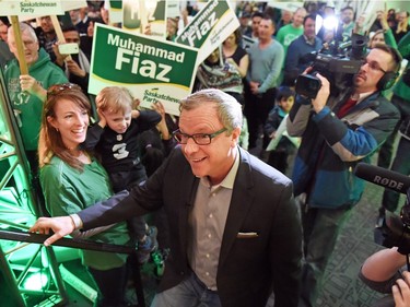 REGINA SK: APRIL 01, 2016 – Saskatchewan Party Leader Brad Wall walks onto the stage at Queensbury as  Megan Patterson (L) and her son Kane Osmar look on during a Sask Party rally in Regina during a campaign stop. DON HEALY