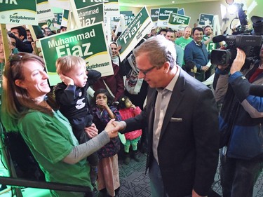 Saskatchewan Party Leader Brad Wall shakes hands with Megan Patterson and her son Kane Osmar during a Sask Party rally at the Queensbury (Salon A) in Regina during a campaign stop.