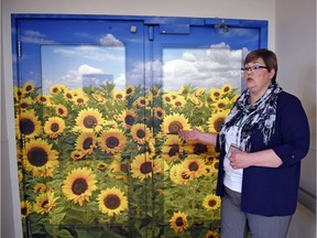 Debbie Sinnett, executive director of long-term care for the Regina Qu'Appelle Health Region, stands by the exit doors to the southern Saskatchewan dementia assessment unit at Wascana Rehabilitation Centre in Regina. The five-bed unit will provide specialized care and treatment for persons with dementia within the southern half of the province.
