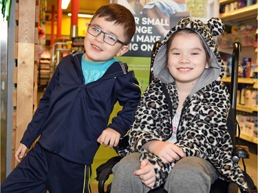 Kash Bird and his sister Katana during a Crawford's No Frills, President's Choice Children's Charity event that saw $18,450 donated by the charity towards purchasing a wheelchair accessible vehicle for the family.