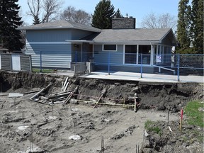 A large hole at 2701  Thornton Ave. where Usonia Homes  was supposed to be building a new home. The project has been underway for three years with few signs of construction in sight.