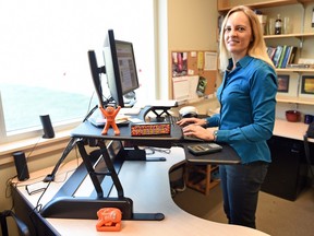 Katya Herman works at her sit-stand desk at the University of Regina.