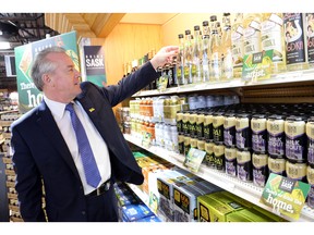 Minister responsible for SLGA Don McMorris looks over Saskatchewan product at the South Albert Liquor store in Regina in 2015.