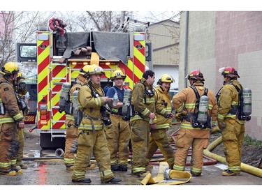 Firefighters at Wilf's Autobody Tuesday afternoon.