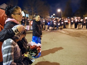 Tara Amyotte comforts Derek Amyotte during a vigil being held to draw attention to violence in North Central at the first vigil in February.