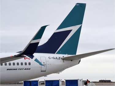 WestJet planes on the tarmac at Regina International Airport.