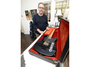 Peter Sawchyn with a rare guitar he's selling on consignment for an owner: it was used by Roy Nichols, guitar player for the legendary Merle Haggard.