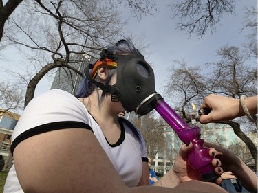 People indulge in Victoria Park in Regina on 4/20.