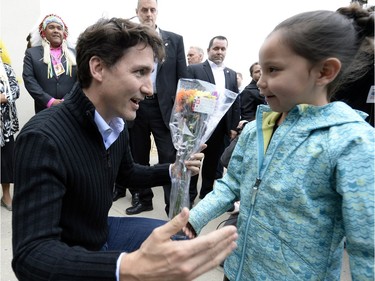 Prime Minister Justin Trudeau meets seven year old Keslee Bear from Muskowpeetin first nation as he arrives at the Treaty Four Governance Centre in Fort Qu'Appelle Saskatchewan Tuesday April 26, 2016 before meeting with the leaders of the File Hills Tribal Council.