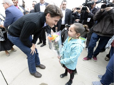 Prime Minister Justin Trudeau meets seven year old Keslee Bear from Muscowpetung first nation as he arrives at the Treaty Four Governance Centre in Fort Qu'Appelle Saskatchewan Tuesday April 26, 2016 before meeting with the leaders of the File Hills Tribal Council.