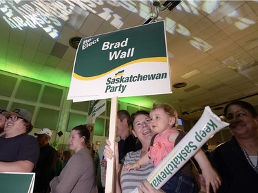 Saskatchewan Party supporters, including 11-month-old Zoey Graham and her grandma Kathy Pratt cheer as results come in at the Palliser Pavilion in Brad Wall's home riding of Swift Current after his third election win in Saskatchewan.