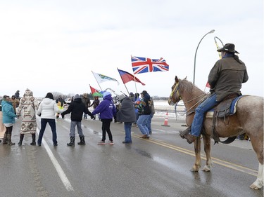 Members of the Peepeekisis First Nation holding a demonstration on Highway 10 near Balcarres to press demands with the federal government for proper negotiations and consultation over a new Contribution Funding Agreement (CFA). The band says the government is forcing it to sign the agreement or risk repercussions.