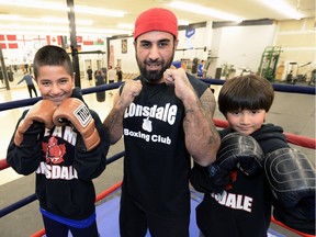 Shelby Mirza is flanked by his sons Quasim, left, and Idris during a recent practice at the Lonsdale Boxing Club.
