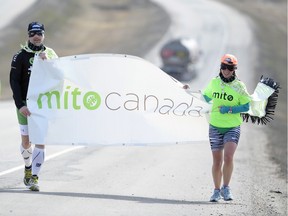 Jon Paradowski, left, and Jen Ruland ran from Regina to Lumsden on Saturday as a fundraiser for the fight against mitochondrial disease.