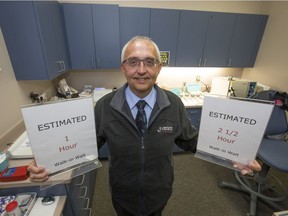 Lakeside Medical Clinic general manager Warner Kabatoff with wait time signs at the clinic.