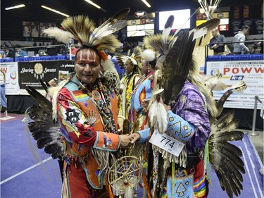 Stan Asapace, left, greets other participants at the FNUC Pow-wow held at the Brandt Centre in Regina on Saturday April 2, 2016.