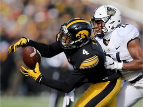 University of Iowa Hawkeyes receiver Tevaun Smith, left, is a top prospect for the 2016 CFL draft.