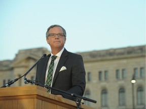 Premier Brad Wall addresses the assembled crowd before the unveiling of the refurbished dome atop the Saskatchewan Legislature in Regina, Monday, May 16, 2016. THE CANADIAN PRESS/Mark Taylor ORG XMIT: MT103