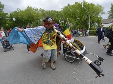 A Tribal Vibes member participates in the kick-off parade of the Cathedral Village Arts Festival in Regina, Sask. on Monday May. 23, 2016.
