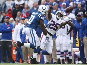 LeSean McCoy #25 of the Buffalo Bills can't make a catch as Jonathan Newsome #91 of the Indianapolis Colts defends during the first half at Ralph Wilson Stadium on September 13, 2015 in Orchard Park, New York.