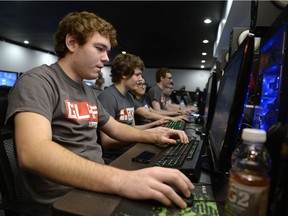 Chad Bosgoed, left, plays League of Legends at a computer at Matrix Gaming Centre in Regina on Sunday Feb. 28, 2016. The group plays League of Legends at a competitive level.