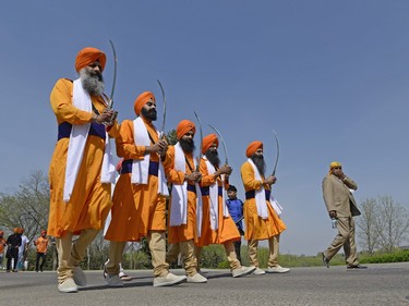 Five men carrying kirpans represent the Panj Pyare (the five beloved ones) during a Sikh Day Parade in Regina, Sask. on Saturday May. 7, 2016. MICHAEL BELL