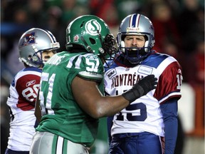 The Saskatchewan Roughriders' Marcus Adams, left, congratulates Montreal Alouettes kicker Damon Duval after he made a game-winning field goal in the 2009 Grey Cup. Adams and Duval are among the former CFL players who will be featured at the upcoming Lions Celebrity Weekend in Regina.