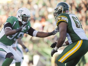 Offensive tackle Thaddeus Coleman, shown with the Edmonton Eskimos in 2013 while facing Saskatchewan Roughriders defensive end Alex Hall, is now a member of the Green and White after being acquired Monday for two negotiation-list players.