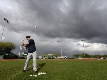 Hitting coach Geoff MacDonald bats fly ball to outfielders during a Regina Red Sox training camp at Currie Field in Regina, Sask. on Monday May. 23, 2016.