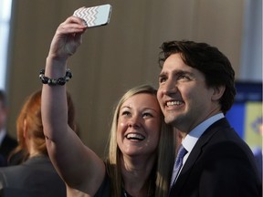 Prime Minister Justin Trudeau has a selfie photo take by teacher Linsdsay Stuart, from Regina, an award recipient at the Prime Minister's Awards for Teaching Excellence in Ottawa, Thursday May 12, 2016.