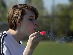 Grade 9 student Cassia Oddo blows bubbles during Mindful Monday on May 16 at Sheldon-Williams Collegiate in Regina.