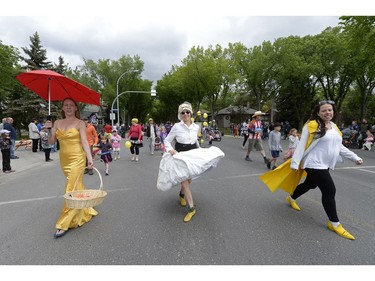 New Dance Horizons members Krista Solheim, Robin Poitras, and Alison Kimbley participate in the kick-off parade of the Cathedral Village Arts Festival in Regina, Sask. on Monday May. 23, 2016.