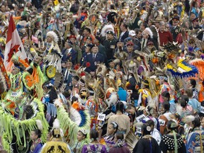 Performers enter during the Grand Entrance of the 31st Annual First Nations University of Canada Pow Wow in 2009 at the Brandt Centre.