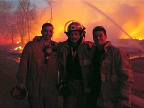 Ryan, Terry and Tyler Carnochan met up during a break in fighting the massive fire in Fort McMurray. The father and sons are all firefighters in the area.