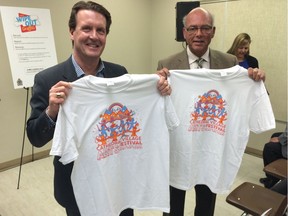 Mayor Michael Fougere and Police Chief Troy Hagen, show off their new Cathedral Village Art Festival shirts.