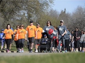 Participants walk during an MS Walk in Wascana Centre in Regina, Sask. on Sunday May. 1, 2016.