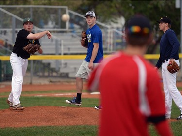 Pitcher Chase Nistor, left, throws to first during a drill at a Regina Red Sox training camp at Currie Field in Regina, Sask. on Monday May. 23, 2016.