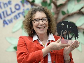 Author Rona Arato holds up her Willow Award, Saskatchewan's Young Readers Choice Awards, at MacNeill School in Regina on Friday.