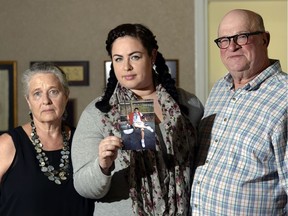 Then 19-year-old Misha Pavelick was killed 10 years ago on the May long weekend. Susan Martin, from left, mother, Kathleen Marshall, sister, and Lorne Pavelick, father, pose for a portrait with a photo of Misha in Regina on Friday.
