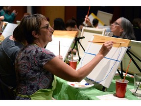 Beer Bros. Gastropub & Deli hosted a Paint Nite event with artist Jamie Reynolds in Regina on Thursday.Yvonne Bloos works on her painting.