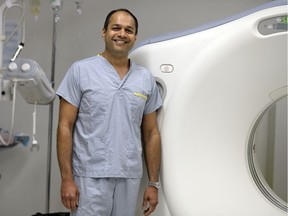 Dr. Kunal Goyal, department head of medical imaging for the Regina Qu'Appelle Health Region, stands by a CT scanner at the Regina General Hospital.