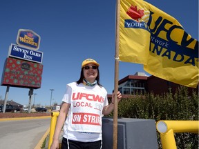 UFCW member Girlie Basco walks the union's picket line in front of the Best Western Seven Oaks hotel in Regina — 4 1/2 months into this strike.