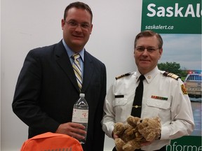 REGINA SASK MAY 3, 2016: Regina Walsh Acres MLA Warren Steinley and Commissioner Duane McKay show some of the items you should have in your emergency preparedness kit for the launch of the 20th Emergency Preparedness Week. CRAIG BAIRD/LEADER-POST