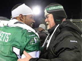 Then-Saskatchewan Roughriders president-CEO Jim Hopson, right, celebrates the team's 2013 Grey Cup victory with running back Kory Sheets at Mosaic Stadium.