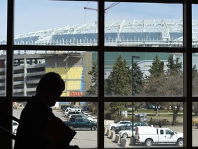 Foot traffic on the stairs at the Queensbury Convention Centre at Evraz Place has a great view of the new Mosaic Stadium under construction on the grounds.