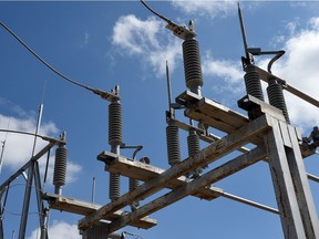 A SaskPower worker replaces a transformer in Regina.